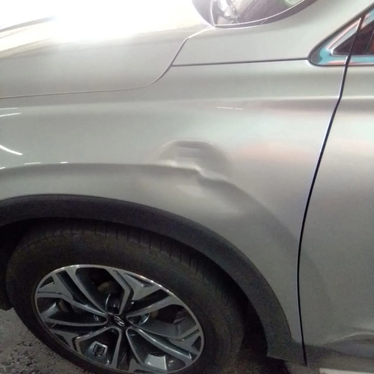 Visible dent before vehicle repair